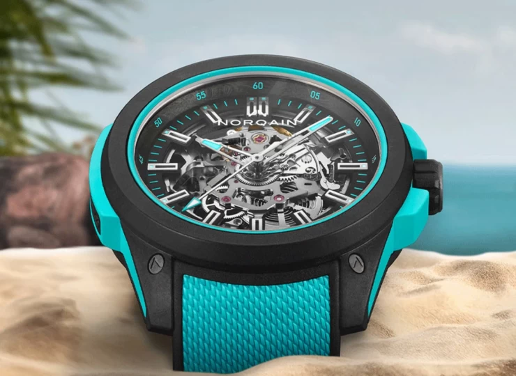 NORQAIN Wild ONE Skeleton 42mm ブラック スケルトン文字盤 ターコイズミラネーゼデザインの一体型ラバーストラップ フォールディングクラスプ N3000.07Q27.B07.R02